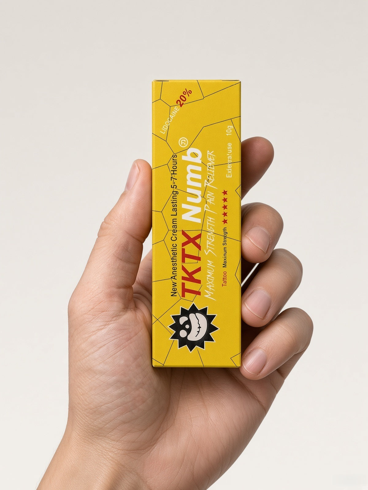 TKTX Yellow cream box held in hand